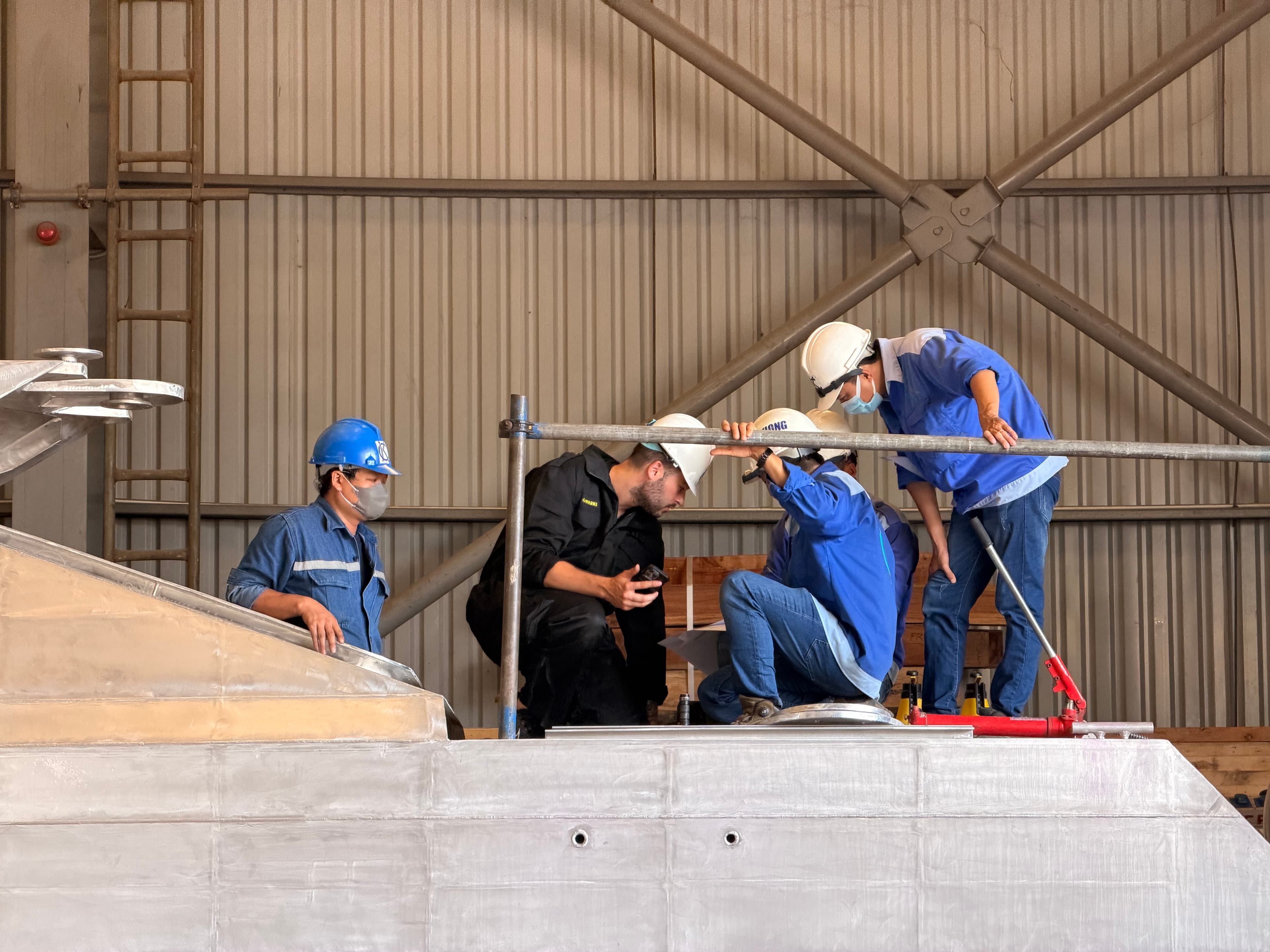 The team inspecting the vessel on deck